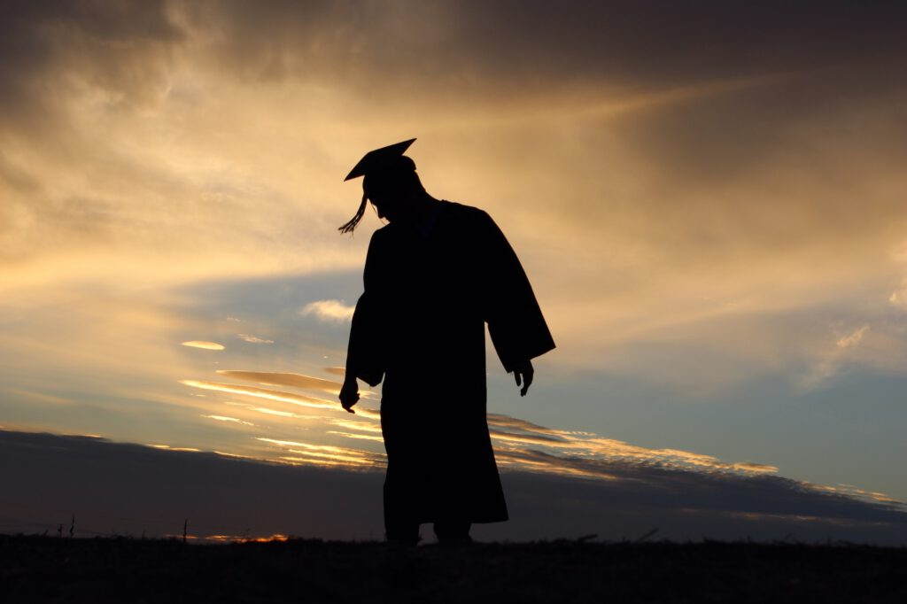 Graduate silhouette. Life moments for a graduate. Feeling proud. Accomplishment. You did it.
